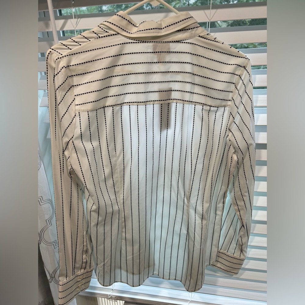 A medium white worthington blouse. Never been worn.